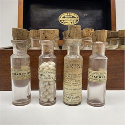 Ashton & Parsons Homeopathic pharmacy box, the fitted interior with thirty glass bottles with cork stoppers and labels to the glass, H10cm, L21cm