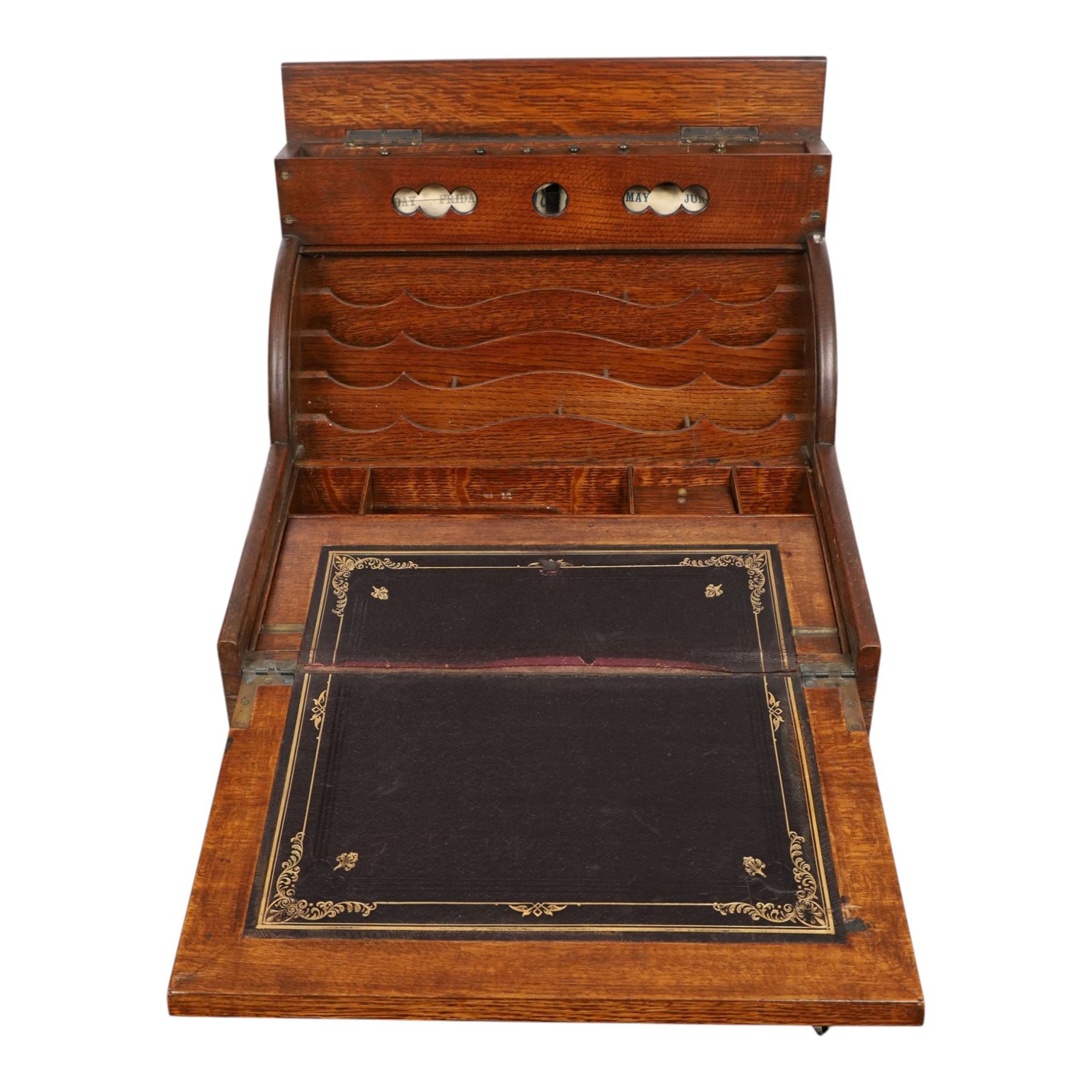 Victorian oak perpetual calendar roll-top desk, tambour front enclosing fitted interior with pigeonholes and pen trays, the raised back fitted with rotating date and month apertures, over single frieze drawer with cast brass handle, on plinth base