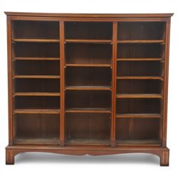 Quality Edwardian inlaid mahogany triple-column open bookcase, projecting cornice over a s...