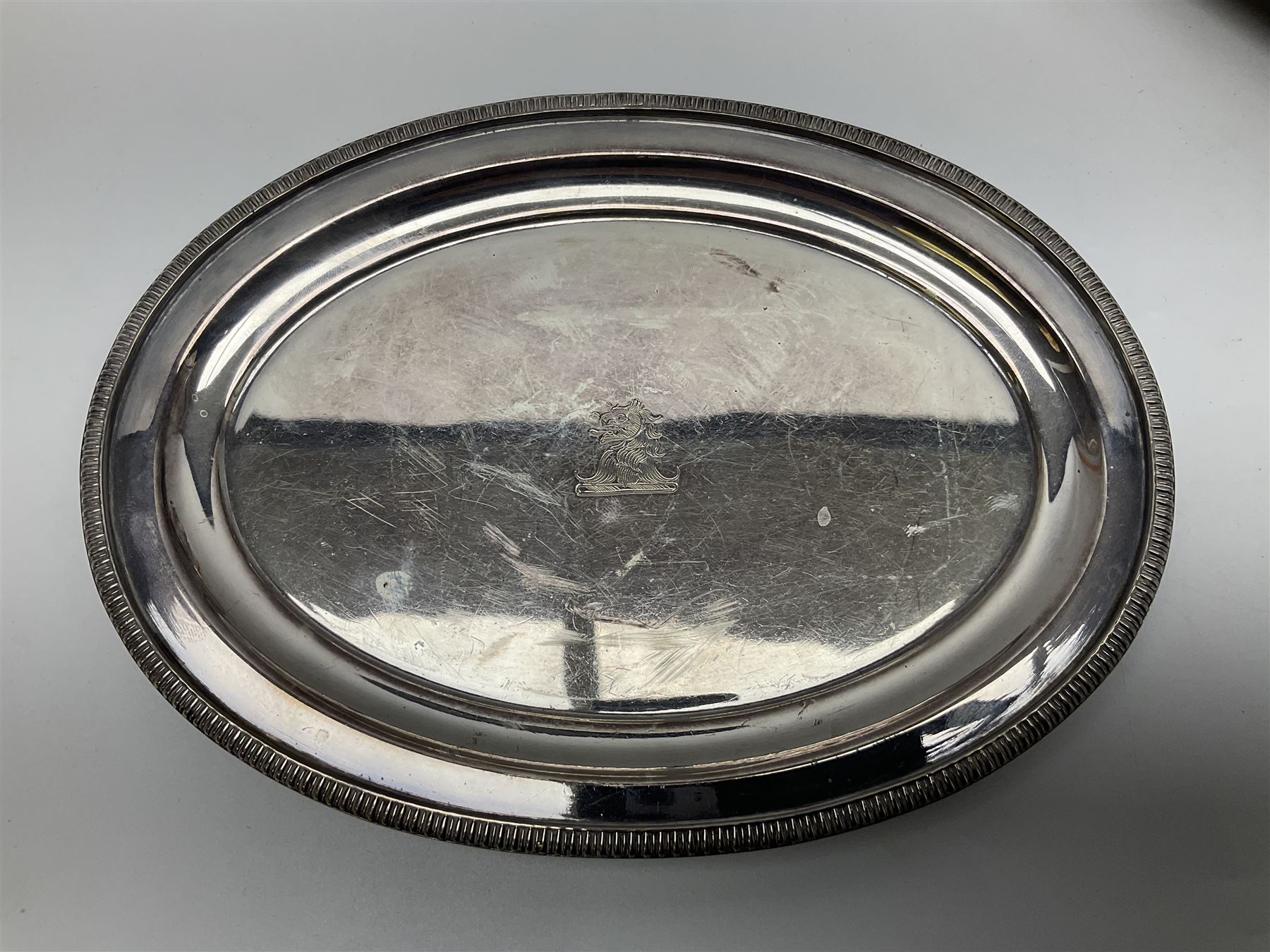 Pair of Mappin and Webb silver plate pierced pedestal bon bon dishes, together with other silver plate comprising teapot stand engraved with lion's head to centre, two cut glass claret jugs, two bottle coasters with acorn decoration, two open salts upon dolphin mounts, tea caddy, three piece cruet set and a large oval tray with pierced sides and upon four ball feet