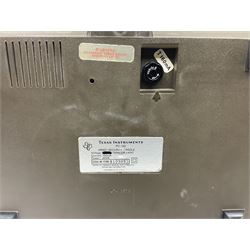 Four 1970s Sinclair electronic calculators - Cambridge in hard case with booklet; Scientific Programmable with Program Library and booklet; Scientific in hard case; and Oxford 300 in soft case with booklet; together with Texas PC-100 SR56 programmable slide-rule calculator on base station with readout, two booklets, keys and cover, serial no.9103093