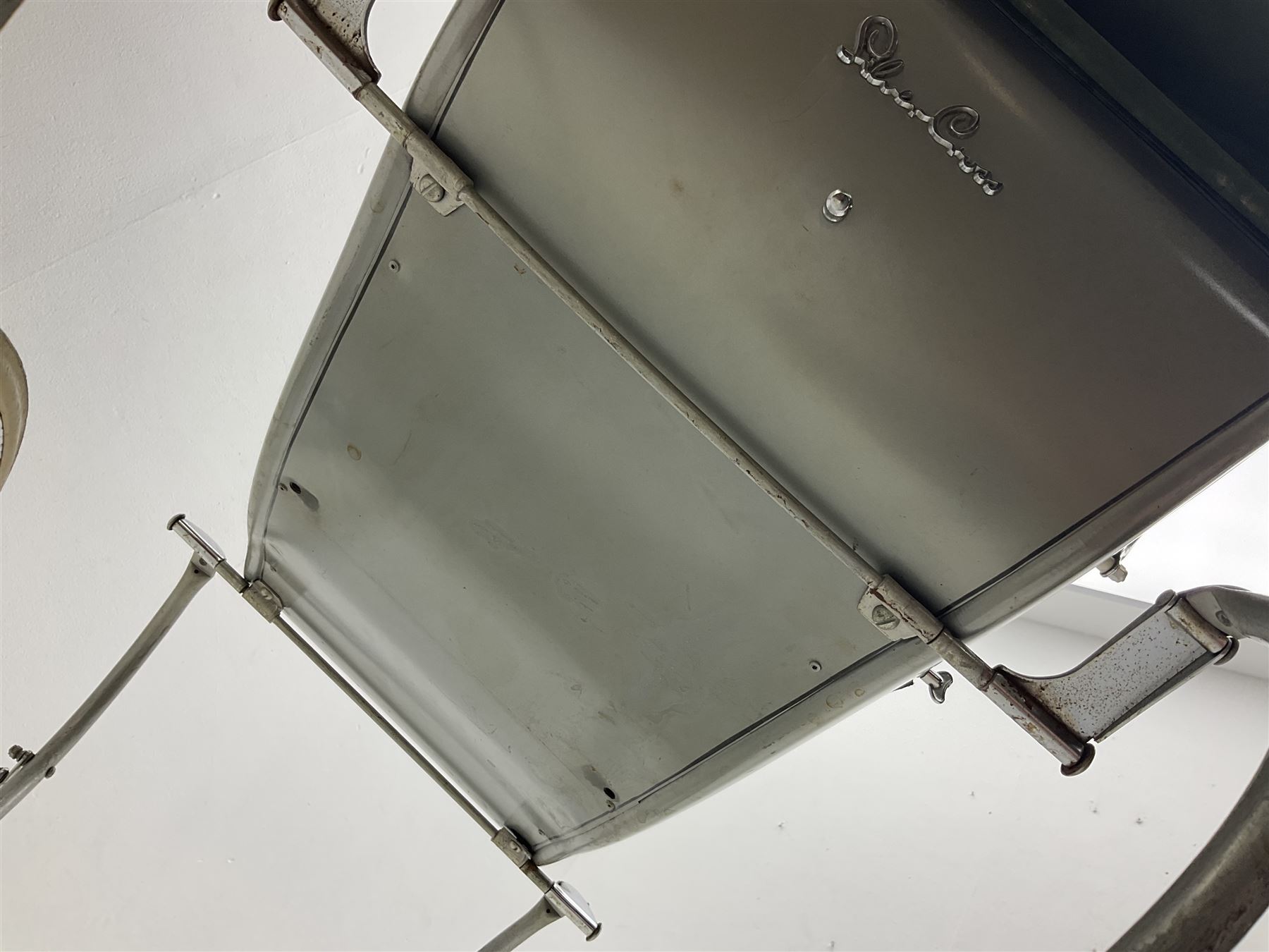 Silver Cross coach-built doll's pram with green fold-down hood and cover, sprung tubular frame, chrome and white handle, four spoked wheels with brake, mattress, pillow and bedding L97cm