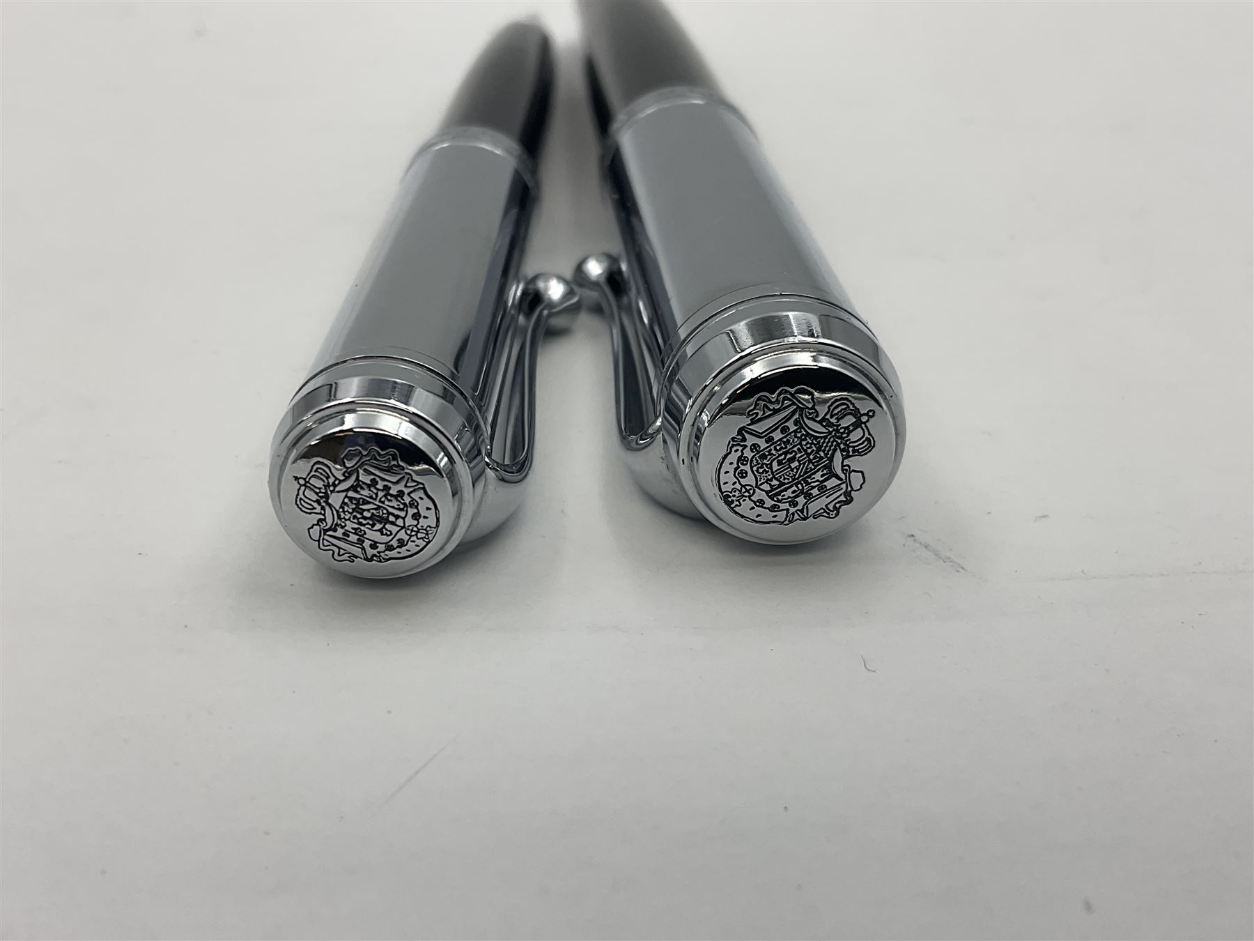 Acqua Di Parma for Aurora fountain pen, the black barrel with chrome mounts and cap, and white gold nib stamped 14K, together with a matching ballpoint pen, L13.5cm (2)