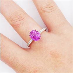 18ct white gold pink sapphire and diamond ring, single oval cut sapphire of approx 2.80 carat, with round brilliant cut diamond shoulders, hallmarked