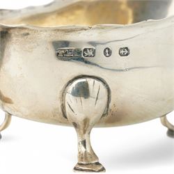 George III silver cream jug with gadrooned edge and leaf capped handle on shaped supports London 1817 Maker Robert Peppin and a small Victorian silver sauce boat with crimped rim Birmingham 1893 Maker Thomas Hayes (2)