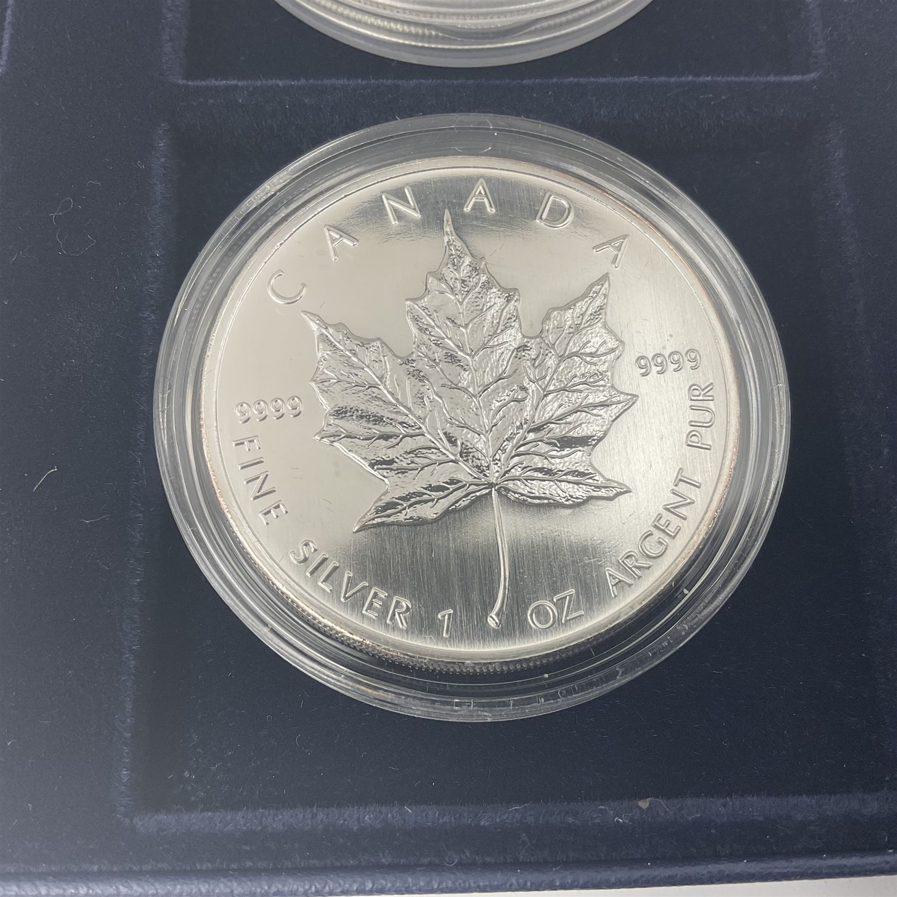 Four one ounce fine silver coins, forming 'The 2007 Famous World Silver Coin Collection', comprising United States eagle, Australian kookaburra, Chinese panda and Canadian maple leaf, cased with Westminster certificate 