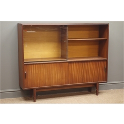  Mid to late 20th century teak bookcase with sliding glass door, adjustable shelves, above two sliding doors, on tapered supports, W123cm, H103cm, D28cm  