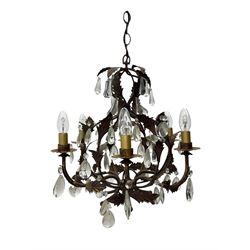20th century distressed gilt tole chandelier, with six curved leaf clasped scrolling arms and frame, hung with lustre drops, approximately H50cm