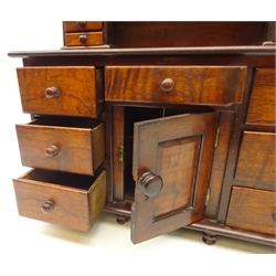  19th century miniature mahogany Lincolnshire dresser, arched back with six small drawers above seven drawers and a recessed cupboard on turned feet, L49cm x W44cm   