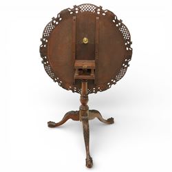 Late 19th century Rococo Revival mahogany occasional table, with shaped circular top with ornate lattice-pierced edge, decorated with pierced scallop motifs and acanthi, raised on a birdcage movement over turned pedestal, terminating to foliate-moulded tripod base with ball and claw feet