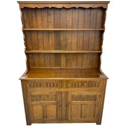 Mid-20th century oak dresser, raised two heights plate rack over two drawers and two cupboards