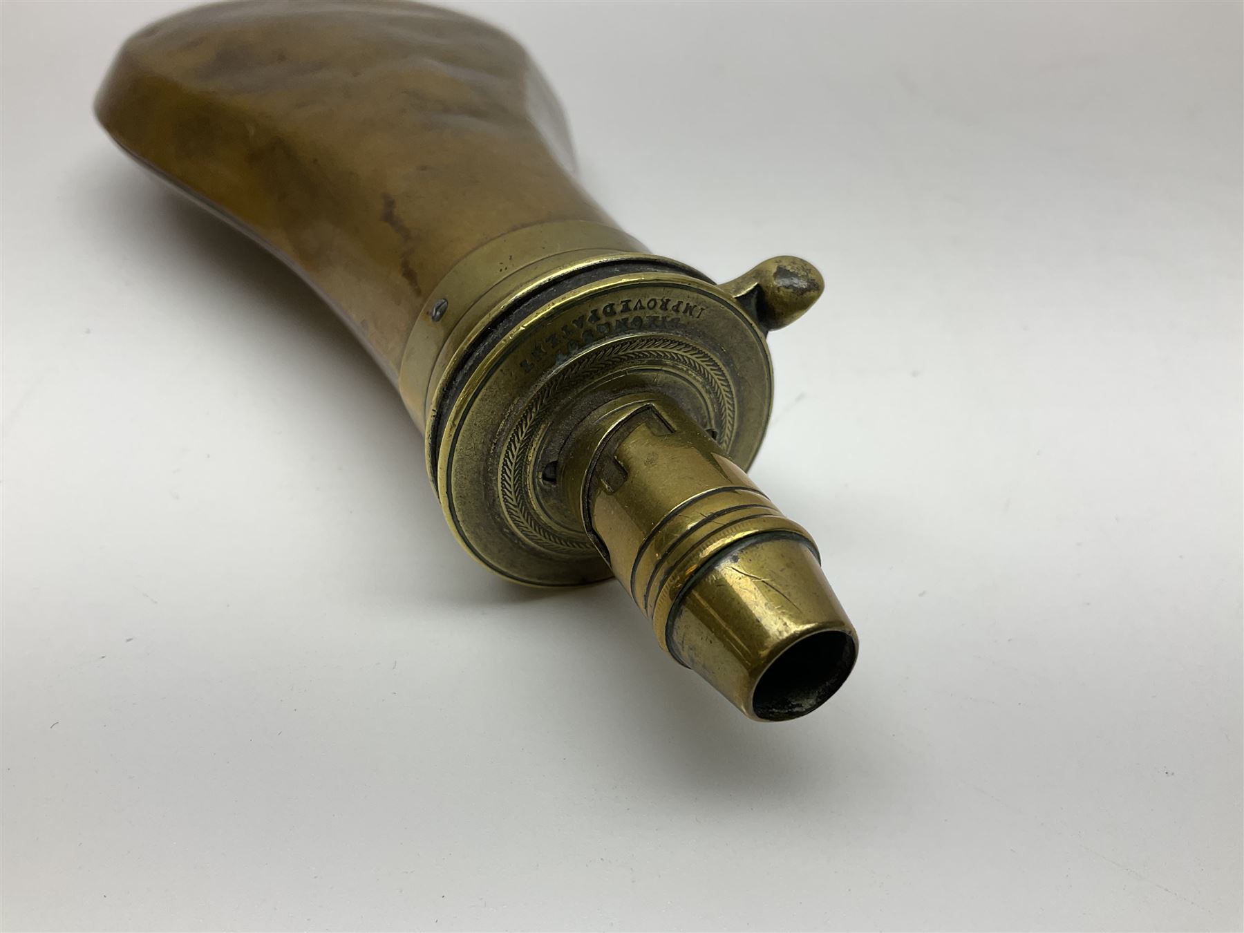 Powder Shot Flask Two brass mounted leather shot flasks with thumb action nozzles; Dixon ...