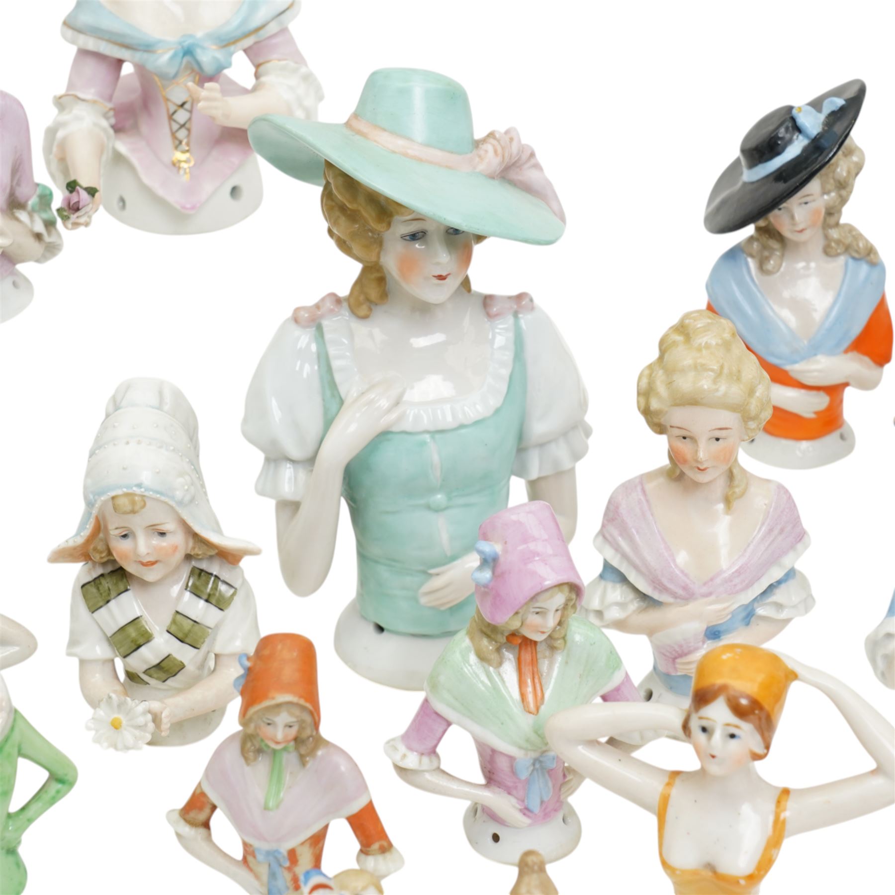 Collection of early 20th century ceramic half dolls, approximately 25