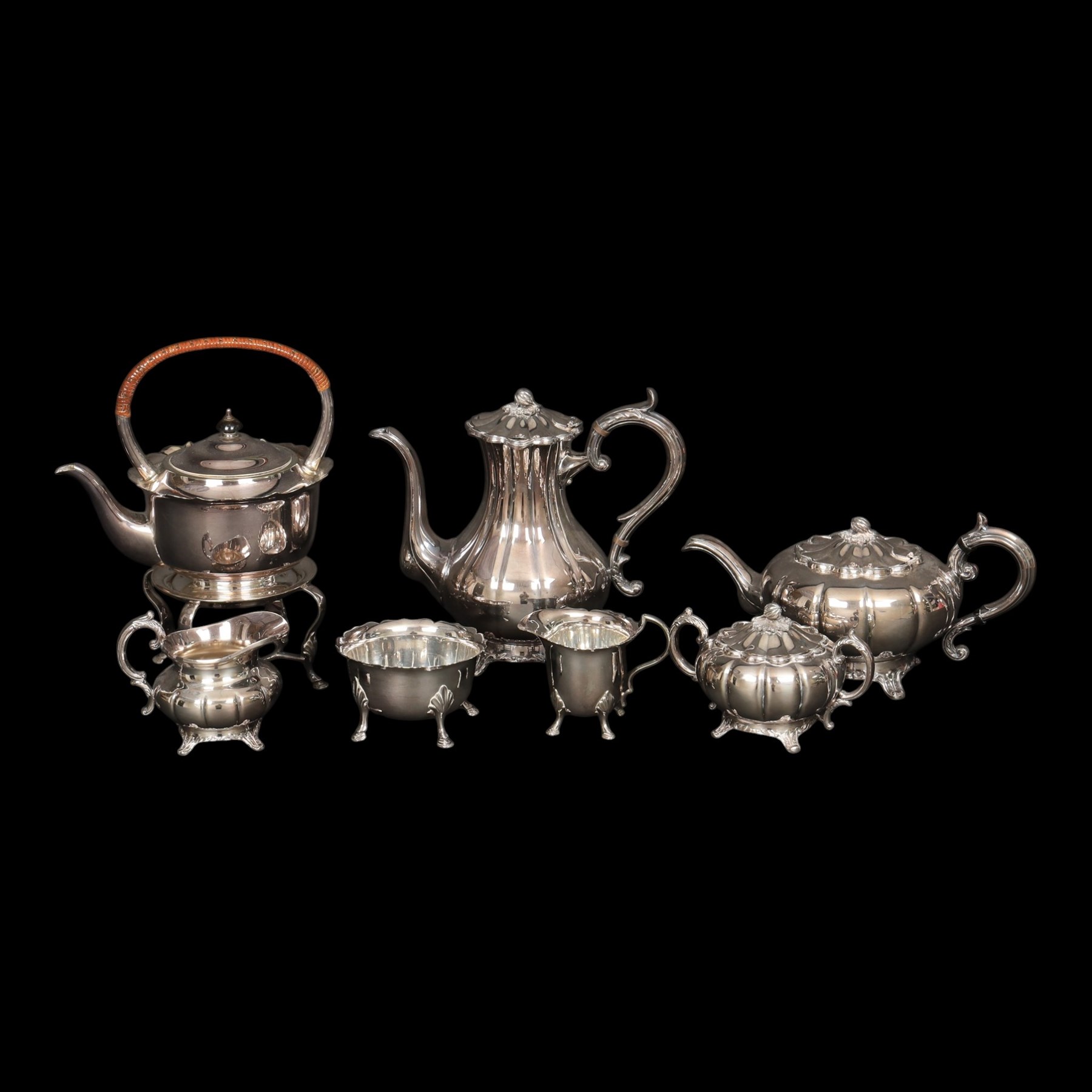 Silver plated four piece melon-shaped tea service by Viners Sheffield, comprising teapot, hot water jug, milk jug and covered sucrier, together with another silver plated tea service 