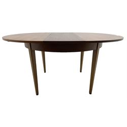 G-Plan - mid-20th century teak extending circular dining table, with concealed additional leaf (W114cm, H72cm); and a set of four mid-20th century teak dining chairs, seat upholstered in beige fabric
