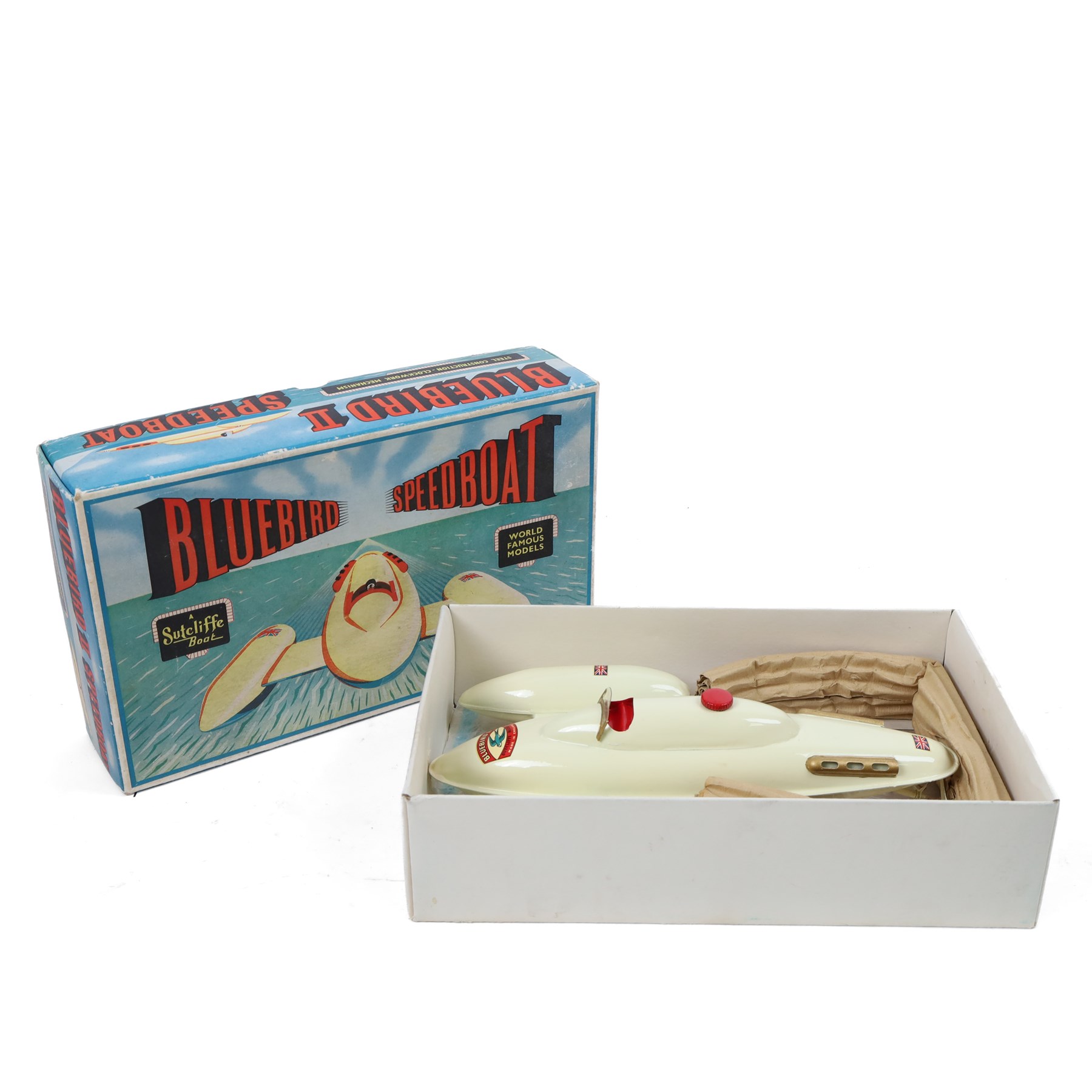 Sutcliffe Models tinplate clockwork 'Bluebird' speedboat, in red and cream livery with metallic gold details and applied decals, with key, boxed