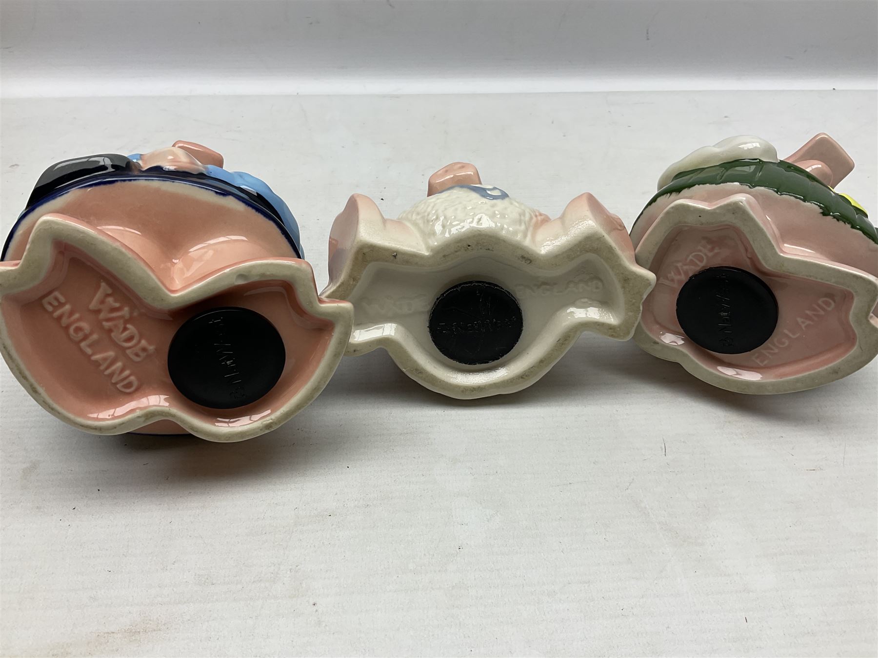 Set of five Wade NatWest money boxes, comprising father, mother, boy, girl and baby, four with original boxes 