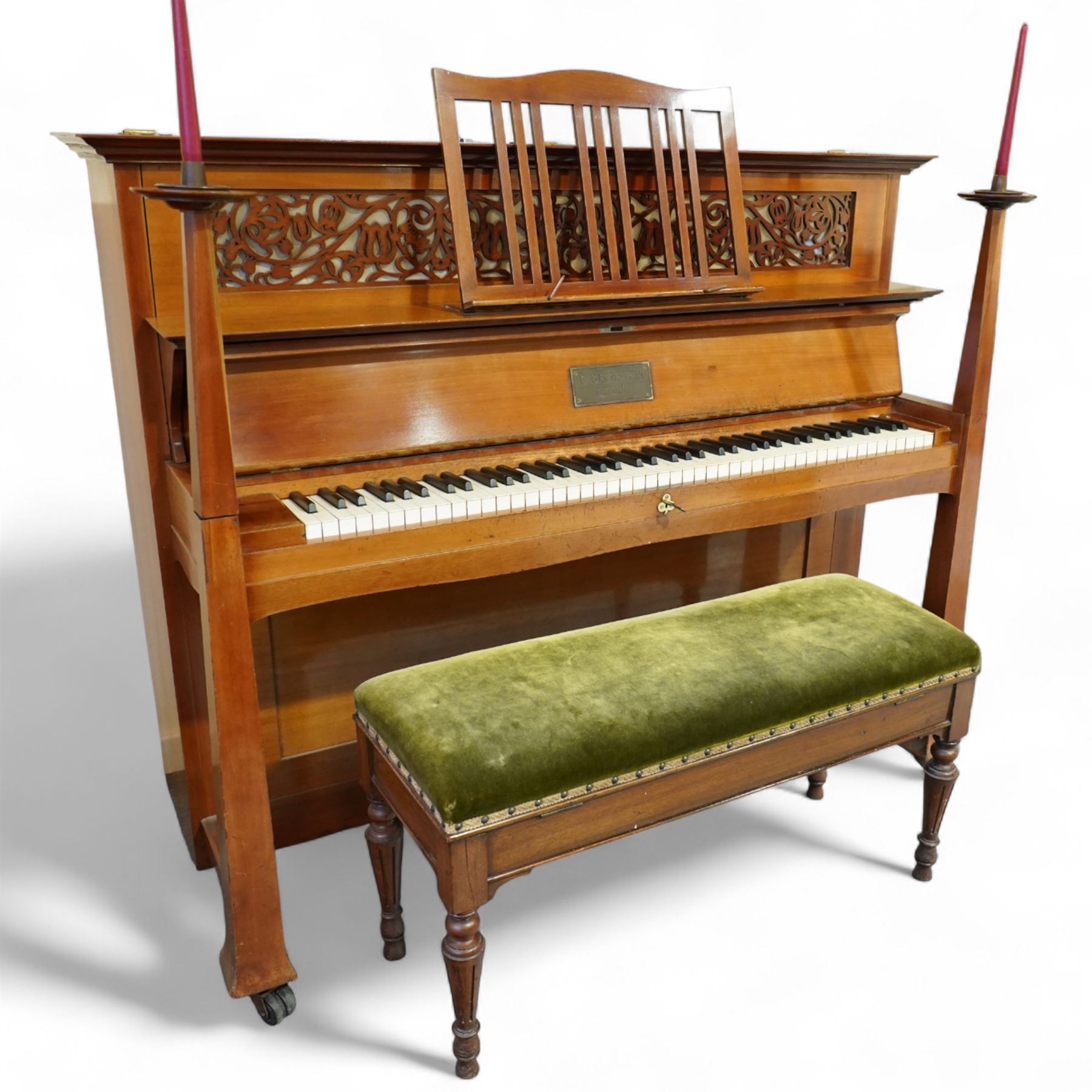 Claud Bechstein- German model IV overstrung upright piano in a mahogany Arts & Crafts designed case by Walter Cave, Serial number 56589 (1900-01), with a lattice music desk and silk backed open fretwork, square key fall with makers name and crafted brass hinges, two candle sconces on tapered square supports, makers name and model number cast into the frame, with an underdamper action, una-corda and sustain pedals, recently re-strung with new tuning pins, responsive action and damping, in very good playing condition, with 85 ivory and ebony keys A0-A7, tuning A=440. Including a period duet stool with a velvet-padded top.
Walter Cave was a leading architect, interior designer, and furniture maker during the Arts & Crafts period, a similar piano to this was owned and played by George Bernard Shaw and is on exhibition at the National Trust property, Shaw's Corner (Hertfordshire).

This item has been registered for sale under section 10 of the APHA Ivory Act, Reference 8P3C9UKA
