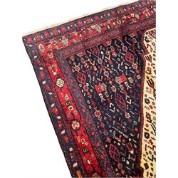 Persian Kurdish rug, blue ground field decorated with various stylised motifs and overlapped lozenge medallion, repeating guarded border