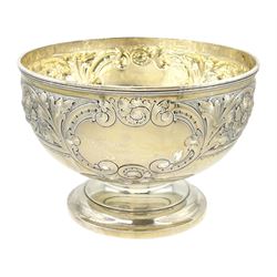 Edwardian silver footed bowl, embossed with foliate scrolls and flower heads between two vacant cartouches, upon stepped circular base, hallmarked Harrison Brothers & Howson (George Howson), Sheffield 1908, H14.5cm D21cm, weight 22.18 ozt (690 grams)