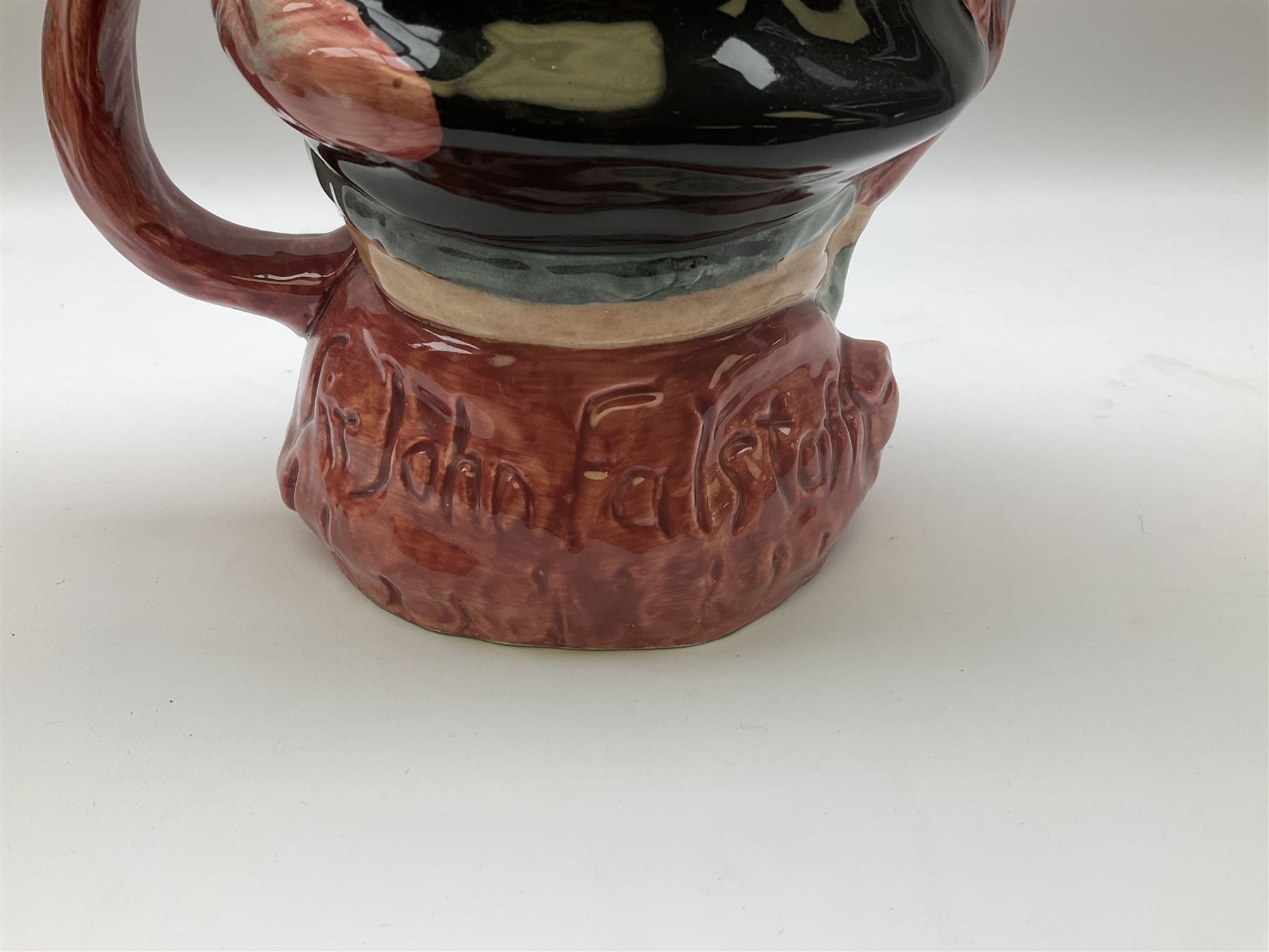 Royal Doulton toby jug of Winston Churchill H23cm and large character jug of Falstaff; together with four collector's plates by Royal Crown Derby, Royal Worcester and Limoges (6)