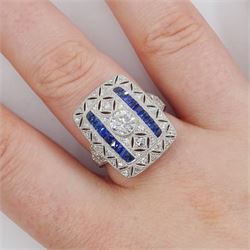 Platinum milgrain set diamond and sapphire ring, the principal old cut diamond of 0.53 carat, with pierced design, single cut diamond and calibre cut sapphire surround, stamped Plat, total sapphire weight 0.30 carat 