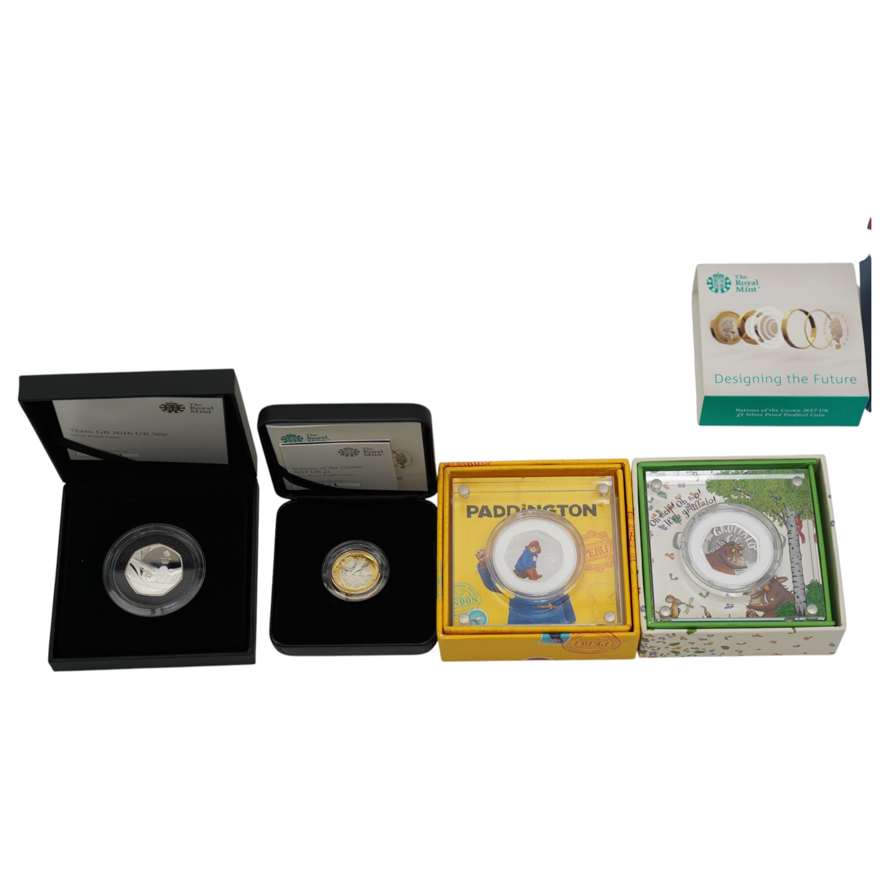 Seven The Royal Mint United Kingdom silver proof coins, comprising 2008 'Queen Elizabeth I' five pound, 2009 'Henry VIII' five pound, 2010 'Restoration of the Monarchy' five pound, 2016 'Team GB' fifty pence, 2017 'Nations of the Crown' one pound, 2018 'Paddington at the Station' fifty pence, and 2019 'The Gruffalo' fifty pence, all boxed with certificates