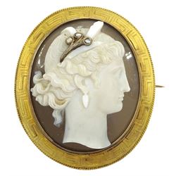 Victorian gold agate brooch depicting bust portrait of a lady in profile, her hairpiece set with three diamonds, the gold surround with key design decoration