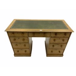 Early 20th century light ash twin pedestal desk, rectangular top with inset leather, nine drawers, plinth base