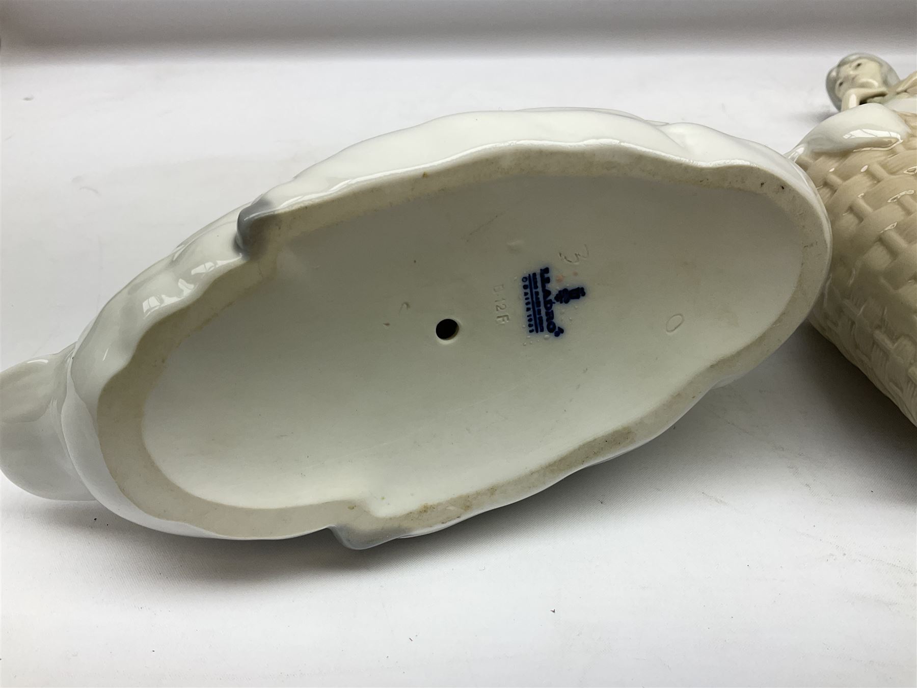 Lladro 'Walk With the Dog' figure no. 4893, together with Lladro swan figure, Porceval figure of a gentleman with a bird perched upon his hand and a further of a lady with flowers beside a basket, all with marks beneath, tallest H40cm