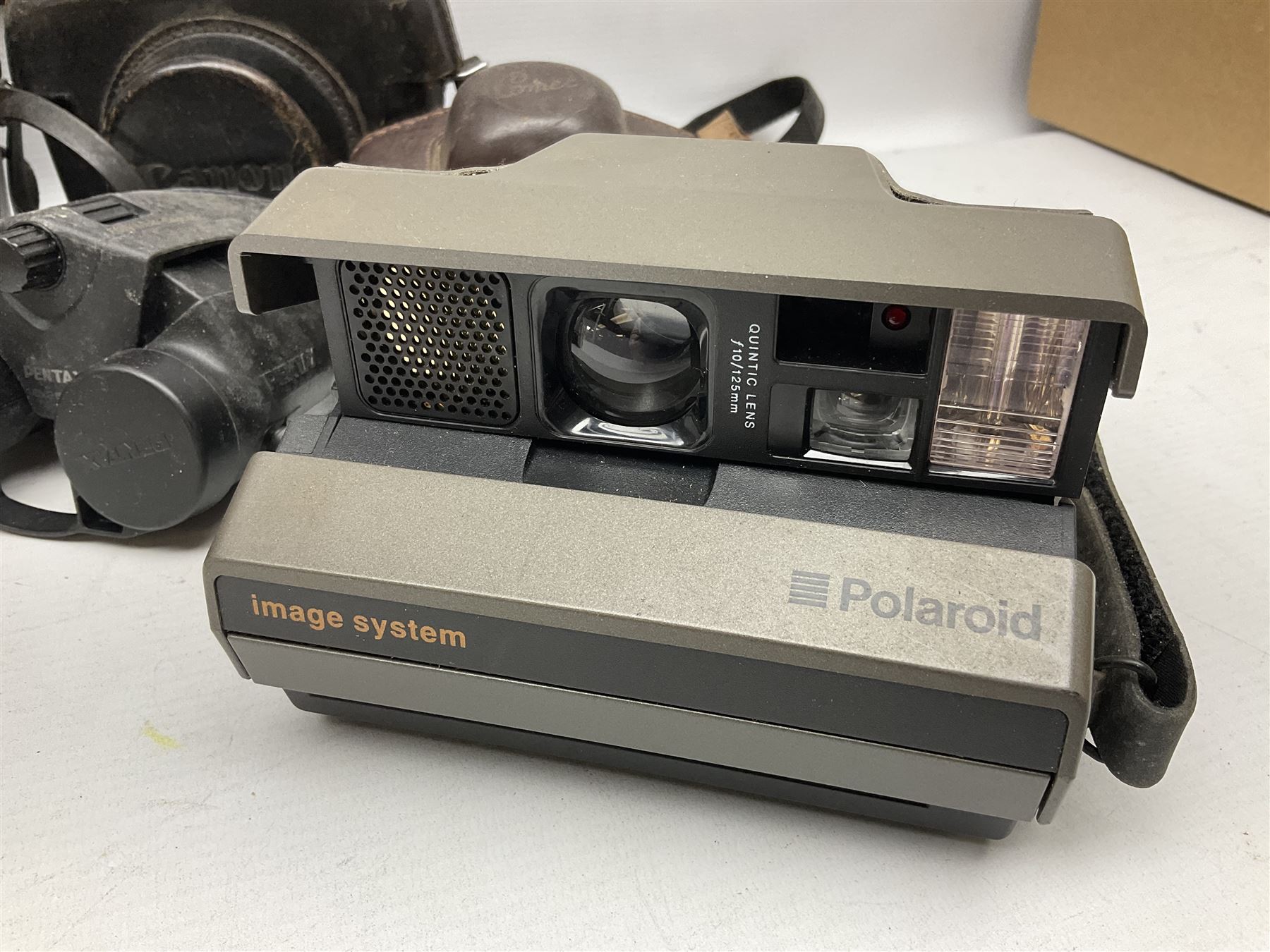 Brass telescope, together with Zenith 7 x 50 field binoculars, two polaroid cameras and other cameras and equipment 