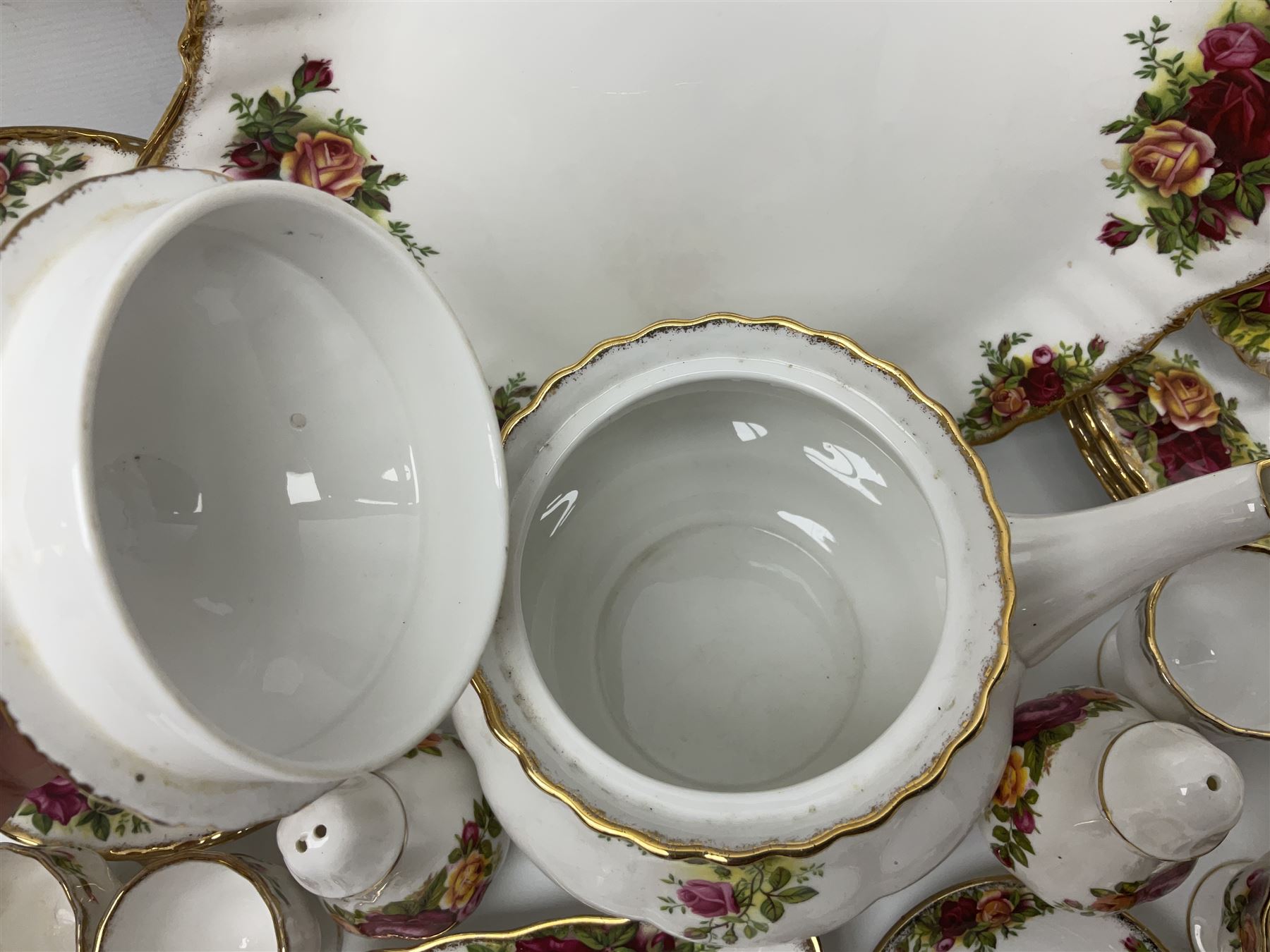 Royal Albert Country Roses pattern part tea and dinner service, to include teapot, four cups and saucers, four dessert plates, cake plate etc, (41)
