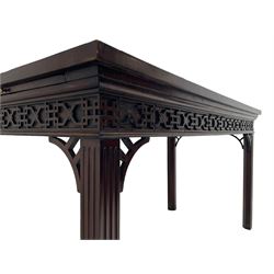 In the manner of Thomas Chippendale - early 19th century mahogany serving table, rectangular crossbanded top with boxwood stringing, the frieze with upper moulding over applied geometric fretwork, the left-hand side fitted with slide, on fluted square supports with inner chamfer 