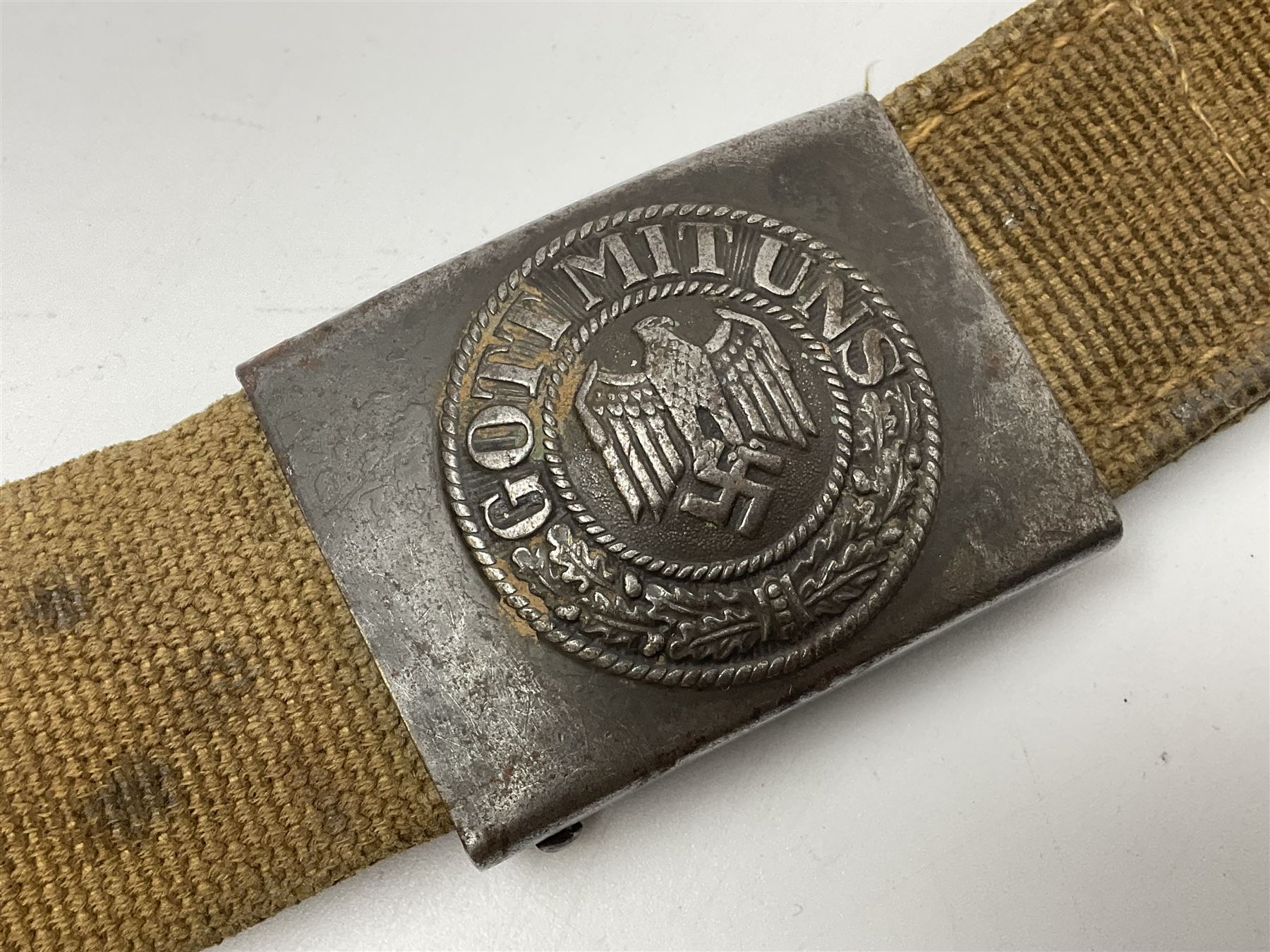 Pair of WW2 German Other Ranks trousers c1940-42, stamped C.& A. Brenninkmeyer Workstatten; WW2 German Army webbing belt with steel 'Gott Mit Uns' buckle; and WW2 German leather belt with 'Stahlhelm' (Steel Helmet League) members buckle (3)