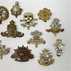 Twelve metal cap badges including South Lancashire Prince of Wales Volunteers, Australian Commonwealth Military Forces, 10th Royal Hussars, Royal Warwickshire, The Royal Sussex Regt., RASC, REME etc