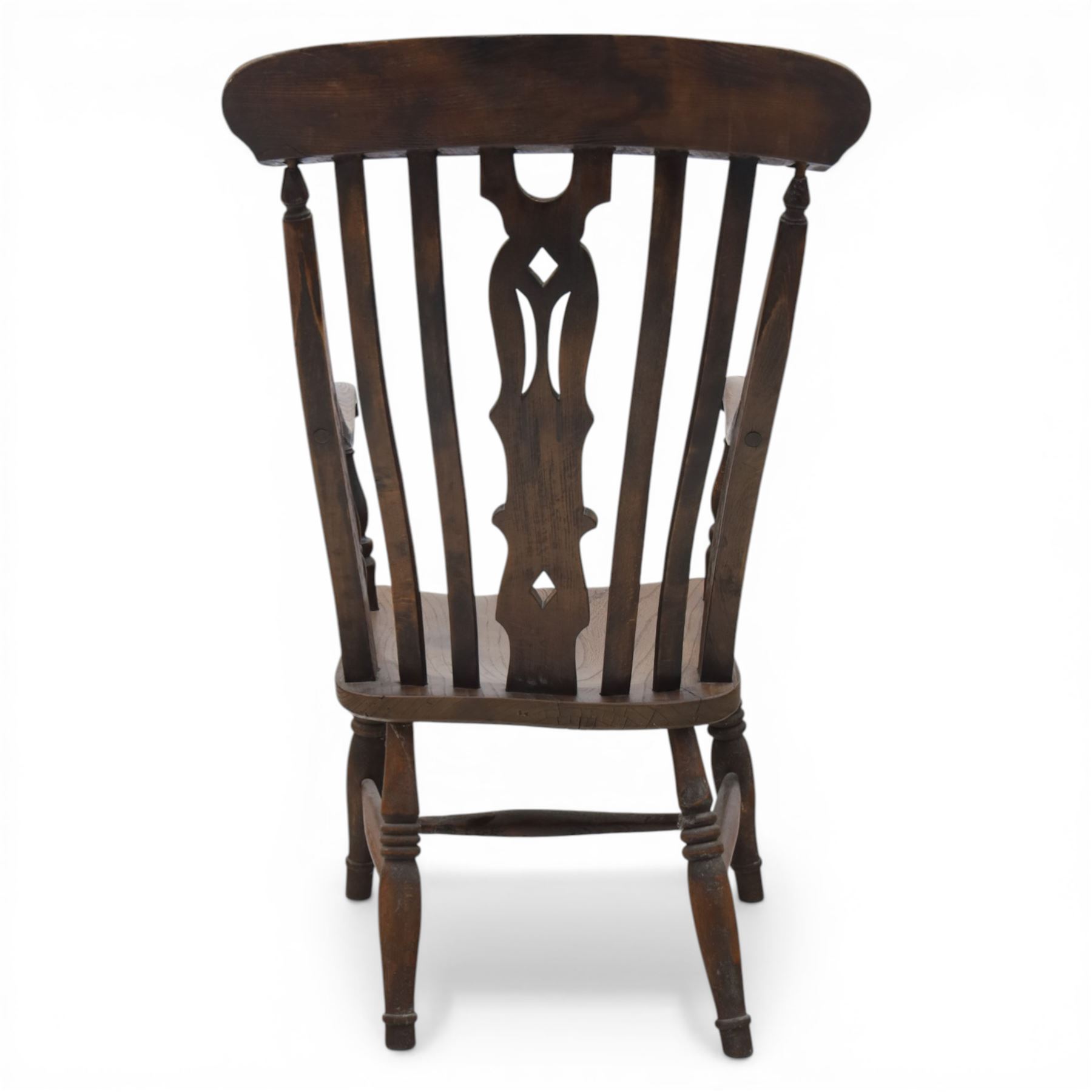 Traditional design elm farmhouse chair, a vase splat flanked by turned spindles, on turned supports united by a H stretcher