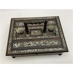 Victorian rosewood and mother of pearl inlaid desk stand, of rectangular form with central carry handle, twin glass inkwells flanking a central stamp compartment, and two pen boxes, upon four compressed bun feet, not including handle H9cm L31cm D25cm