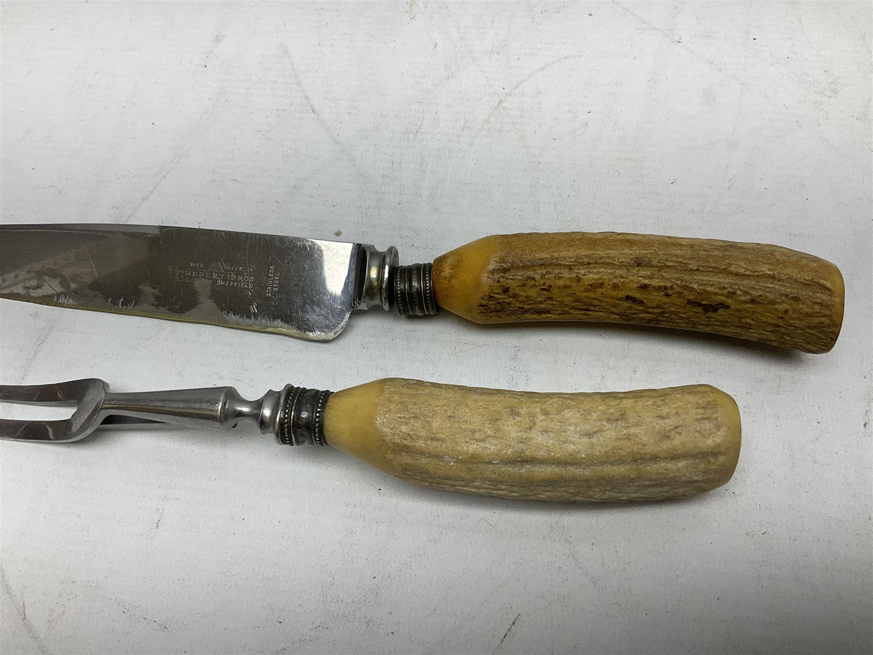 Early 20th century Indian wooden fish scabbard knife and fork serving set, together with other carving instruments with antler handles to include a Walker & Hall example