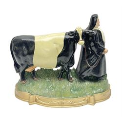 Cast iron doorstop, modelled as a nun walking a cow, H28cm