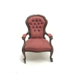 Victorian walnut framed armchair, upholstered in a deep buttoned red fabric, cabriole legs