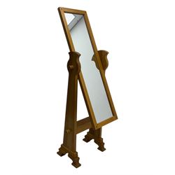 Contemporary light oak cheval dressing mirror, rectangular frame enclosing plain mirror plate, on shaped supports with turned finials, raised on stepped bracket feet