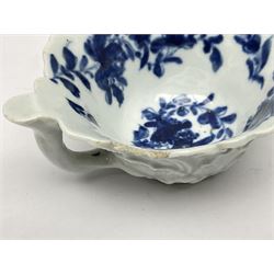 First period Worcester blue and white butter boat, decorated in the Mansfield pattern c1758-1760, with geranium leaf moulded exterior, and interior painted in blue underglaze, with stalk loop handle and thumb rest, and workman's mark beneath, L9cm H3.5cm