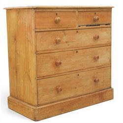 Victorian waxed pine chest, fitted with two short and three long drawers, turned wooden ha...