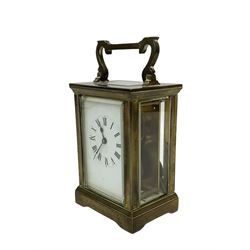 French - late 19th century 8-day timepiece carriage clock in an Anglaise case with carrying handle and rectangular bevelled glass panels, enamel dial with Roman numerals and steel spade hands, with a lever platform escapement, jewelled balance and timing screws. With key. 