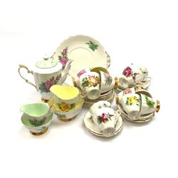 Royal Standard Harry Wheatcroft 'World Famous Roses' tea and coffee wares, comprising teapot, six teacups and six saucers, six coffee cups and five saucers, six side plates, milk jug, cream jug, two open sucriers, and sandwich plate. 