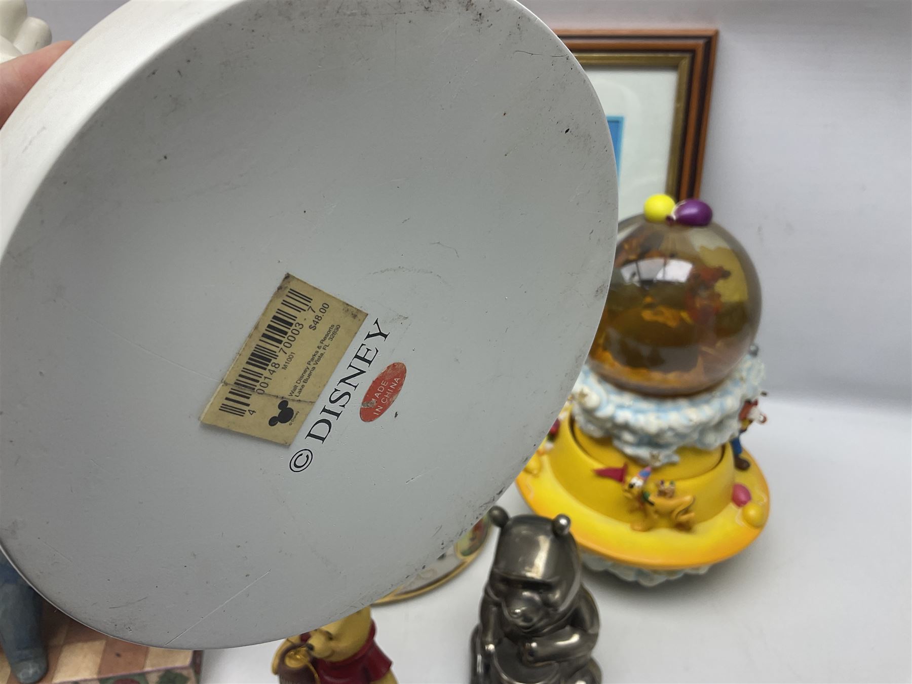 Collection of Disney figures, to include Ardleigh Elliott music box Hunny of the Day, Disney musical snow globe, Micky mouse lazy butler, Framed Bug's Life lithograph etc 