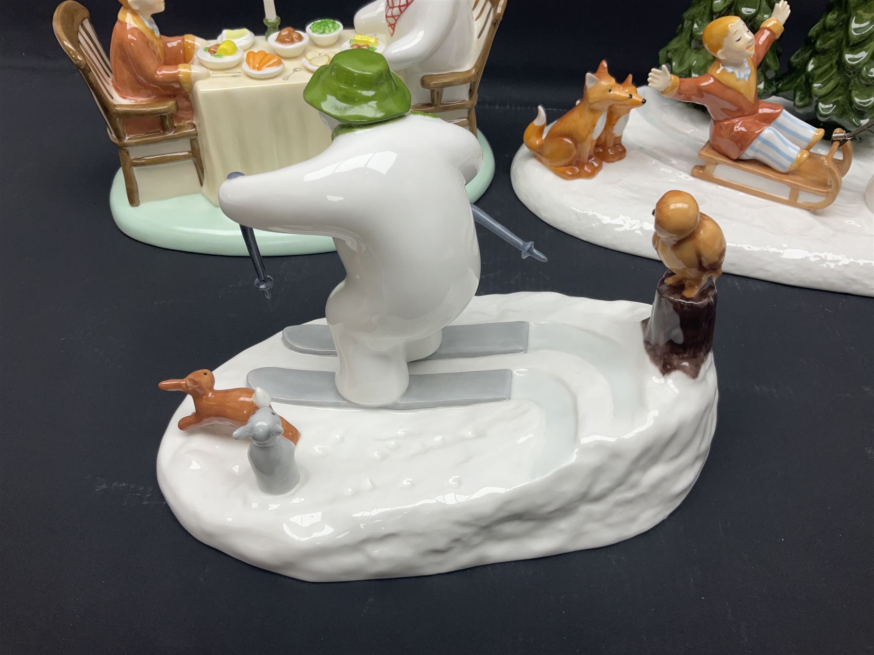 Three Coalport Characters The Snowman figures, comprising Dinner for Two, Off Piste and Winter Fun, all with certificates and original boxes 