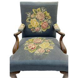 Georgian mahogany Gainsborough armchair, curved and scroll carved arm terminals and supports, the back and sprung seat upholstered in floral tapestry, cabriole supports