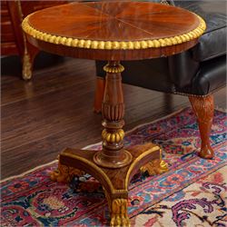 French Empire design rosewood and parcel-gilt occasional table, the circular top with sunb...