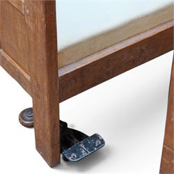 Mouseman - pair of 1930's adzed and panelled oak single beds, the head and foot-boards with arcade-carved cresting rails above adzed panels, with Vibase mattress supports, carved with mouse signature, by the workshop of Robert Thompson of Kilburn